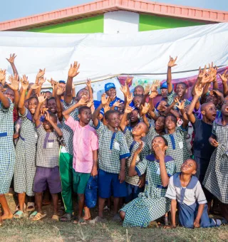 Children Celebrating at OIOTA Outreach Event
